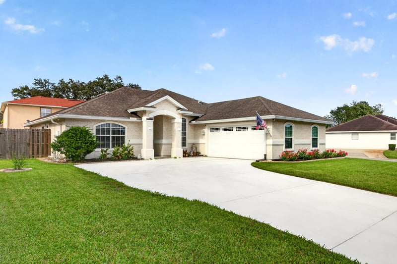 Front exterior facing driveway and two-car garage at 12825 Kelsey Island Dr, Jacksonville, FL 32224
