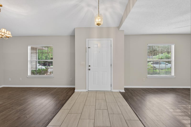 Entryway with wood-look flooring and windows at 1648 Glen Laurel Dr, Middleburg, FL 32068