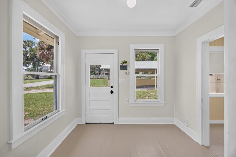 Entry hallway with door and windows at 101 N Lake St, Crescent City, FL
