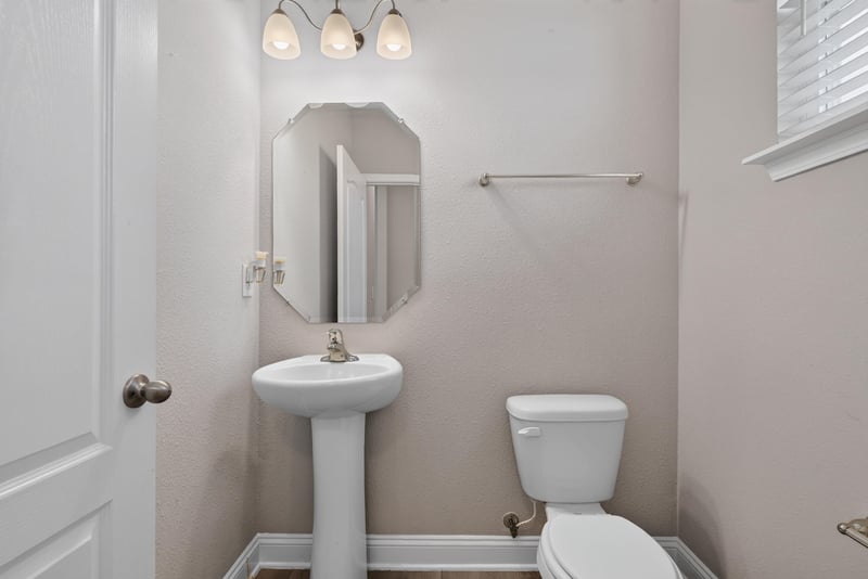 Bathroom with pedestal sink and toilet at 2580 Cold Stream Ln, Green Cove Springs, FL 32043