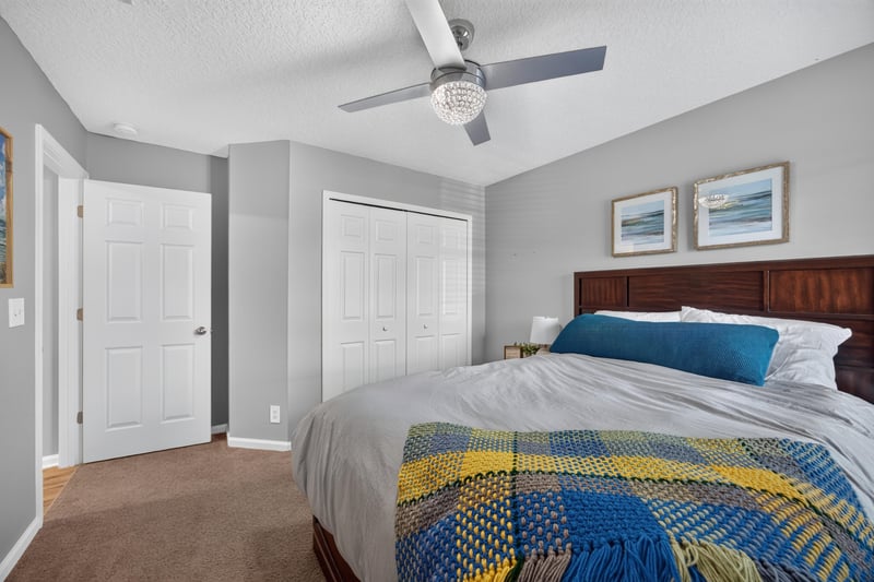 Bedroom with bed and two doors at 12825 Kelsey Island Dr, Jacksonville, FL 32224