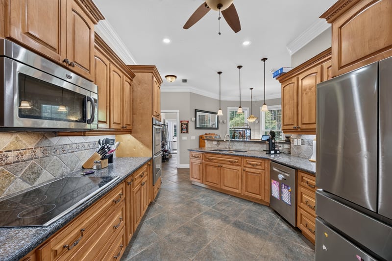 Kitchen counter with range and cabinets at 1735 Hagans Ridge Ct