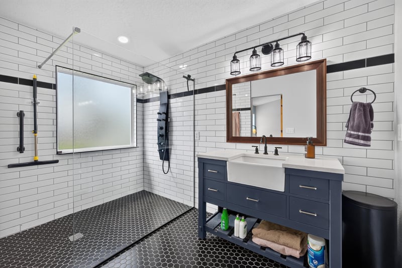 Primary bathroom with subway tile shower and vanity at 2065 Creekmont Dr
