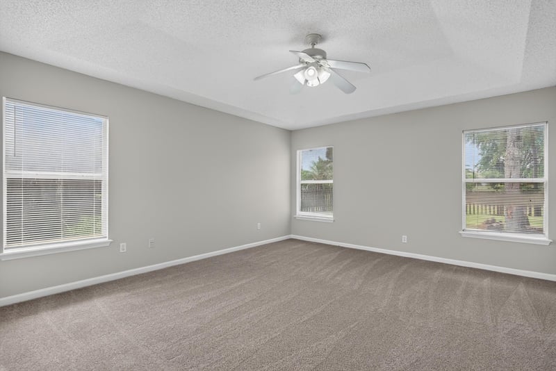 Empty room with two windows at 12949 Chets Creek Dr S, Jacksonville, FL 32224
