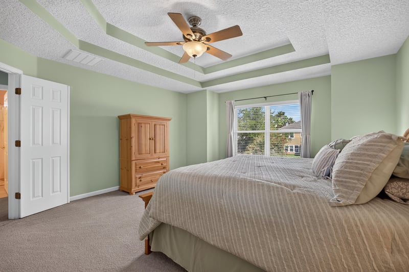 Primary bedroom with neutral carpet and ceiling fan at 3660 Middlebrook Dr, Orange Park, FL 32065