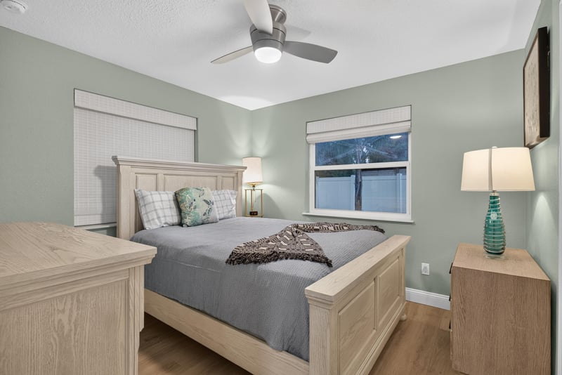 Bedroom with wood bed frame and nightstands at 1525 8th St N, Jacksonville Beach, FL