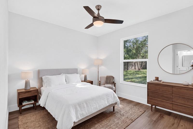 Bedroom with staged bed and dresser at 8453 Boysenberry Ln W, Jacksonville, FL