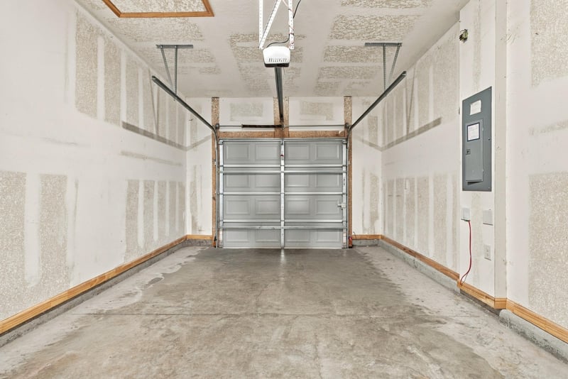 Garage interior with garage door and storage space at 9555 Star Dr, Jacksonville, FL 32256