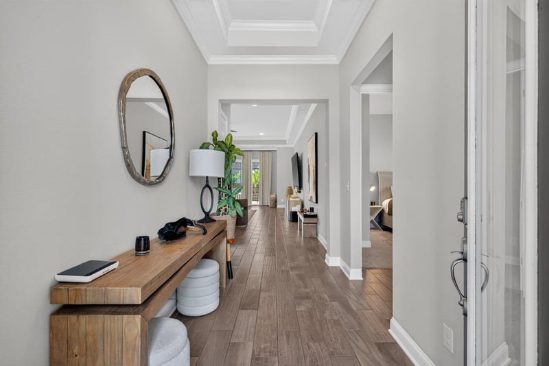 Entry hallway with console table leading to the kitchen at 3328 Southern Oaks Dr, Green Cove Springs, FL 32043