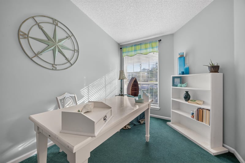 Office area with desk and shelving at 4556 Shaky Leaf Ln N, Jacksonville, FL 32224