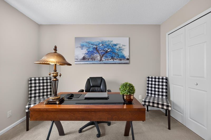 Home office with desk lamp and wall art at 3067 Wavering Ln, Middleburg, FL 32068