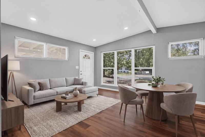 Living room with wood floors and dining area at 1928 Montmarte Dr, Jacksonville, FL 32210