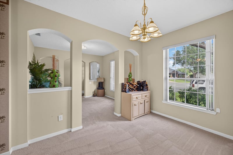 Formal living room with large window at 2875 Pebblewood Ln, Orange Park, FL 32065