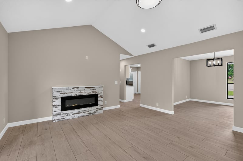 Living room fireplace with vaulted ceiling at 4117 Wilcrest Ct, Jacksonville, FL 32277