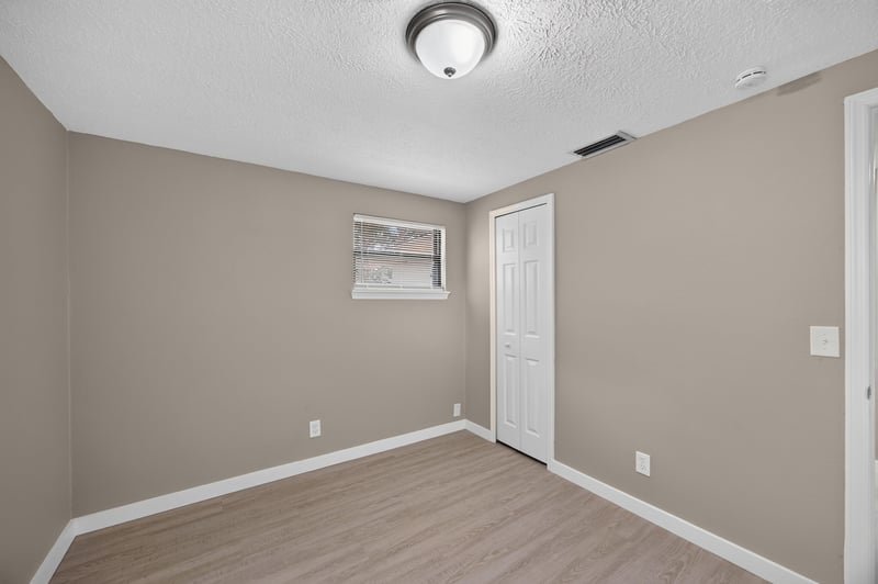 Empty bedroom with closet door at 184 Draco St, Orange Park, FL 32073