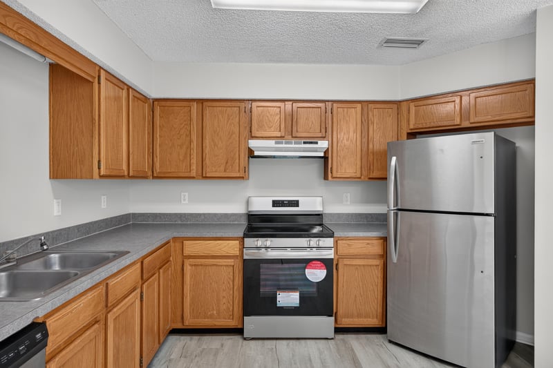 Kitchen with gas range and refrigerator at 8519 Blazing Star Ct, Jacksonville, FL 32210