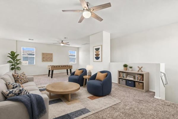 Loft set up as a casual lounge, virtually staged