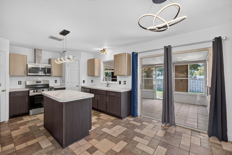 Kitchen with sliding glass doors to backyard at 3428 Glenn Hollow Ct, Jacksonville, FL 32226