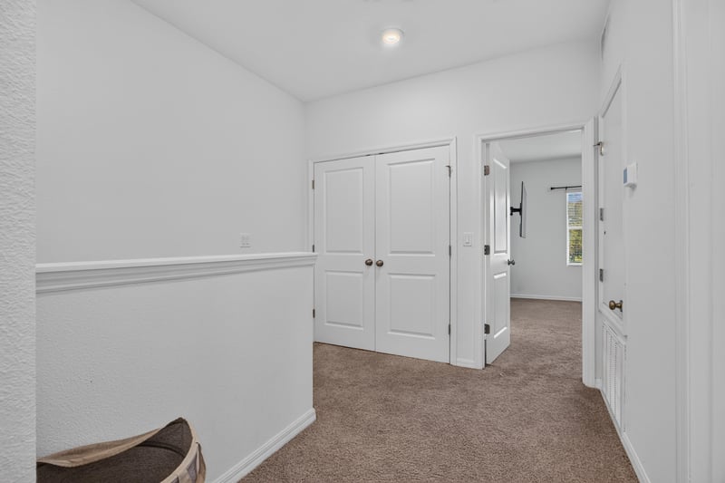 Hallway with closet doors and carpet at 339 Anthony Dr, Jacksonville, FL