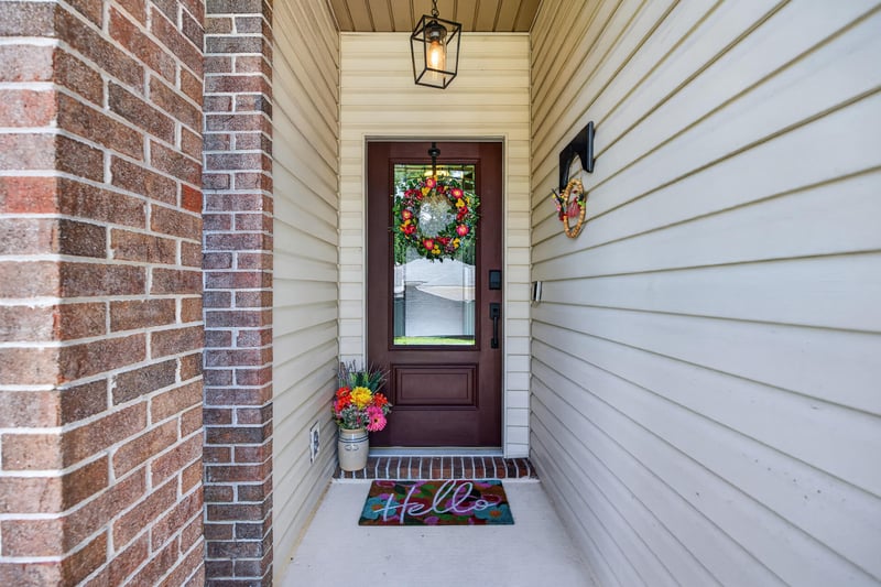 Front entry door with brick trim at 1589 Backwater Drive, Middleburg, FL 32068