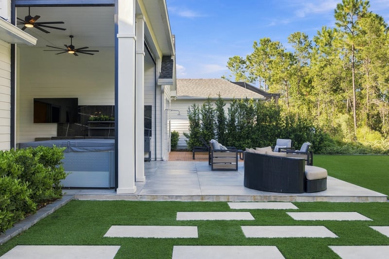 Covered patio with sliding glass doors and seating at 907 Seagrove Dr, Ponte Vedra Beach, FL 32081