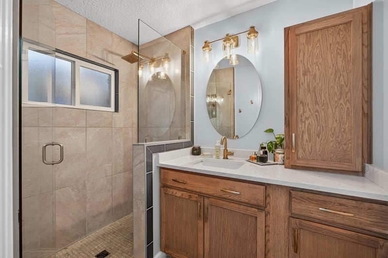 Bathroom with walk-in shower at 1589 Backwater Drive, Middleburg, FL 32068