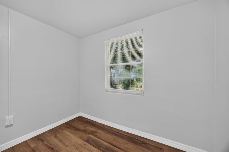 Bedroom corner with window at 4951 Halls Dr