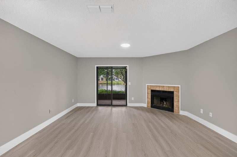 Living room with fireplace and wood flooring at 3801 Crown Point Rd, Jacksonville, FL 32257