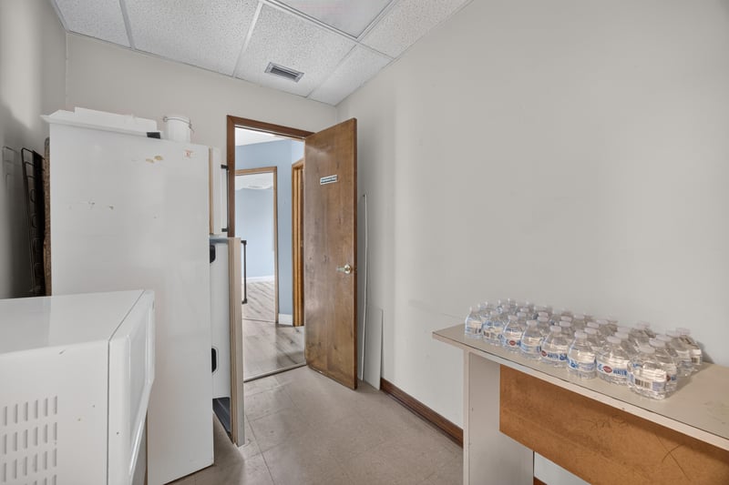 Room with wood-trimmed doorway and cabinet at 1543 Kingsley Ave #19, Orange Park, FL 32073