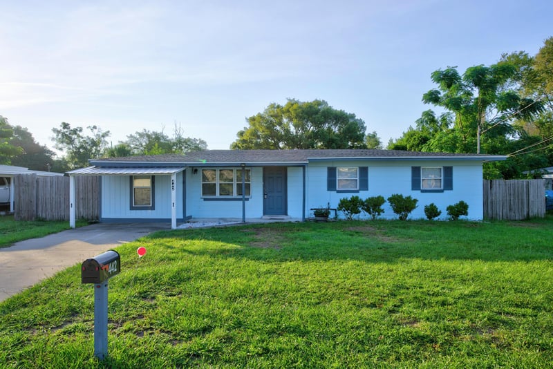 Front exterior with blue siding and green lawn at 442 Ameca Ave, Orange Park, FL 32073