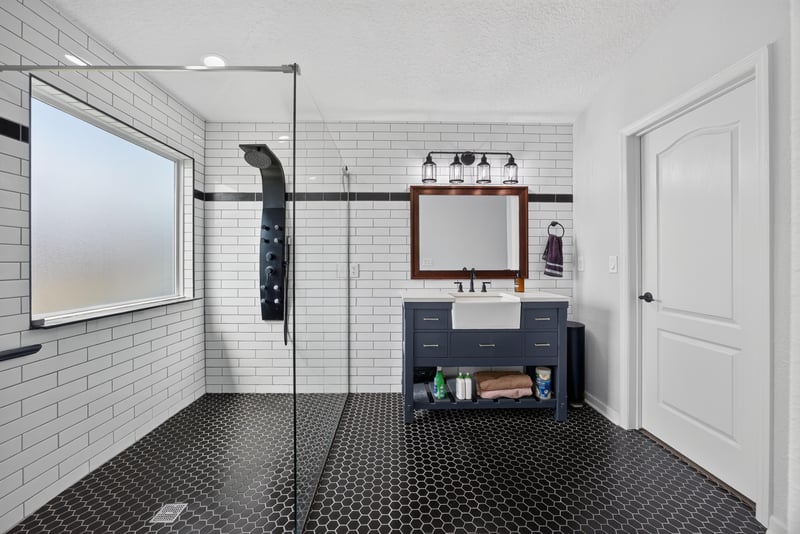 Primary bathroom with walk-in shower and window at 2065 Creekmont Dr