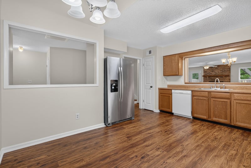 Kitchen pass-through window to living area at 4427 Millstone Ct, Jacksonville, FL