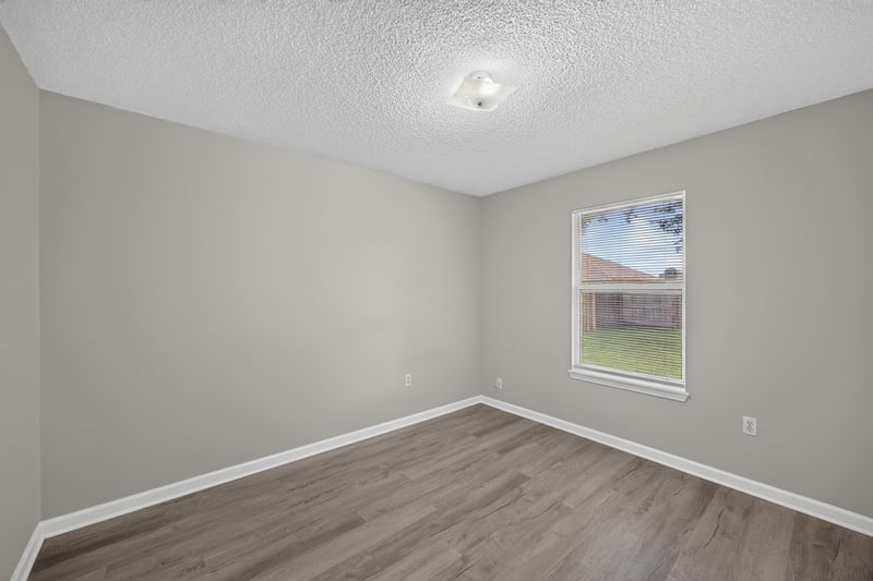 Bedroom with single window at 8519 Blazing Star Ct, Jacksonville, FL 32210