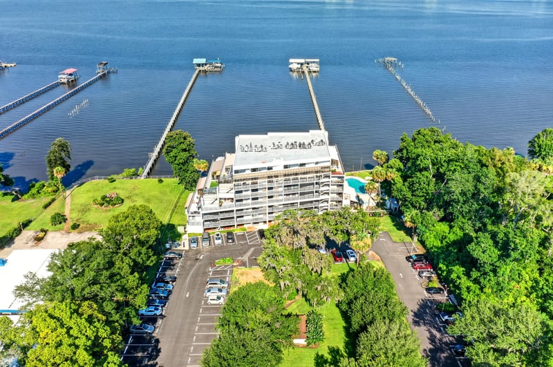 Aerial view of condo building and docks in Jacksonville