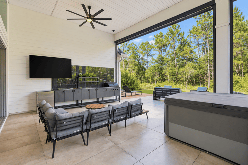 Covered patio with TV and outdoor kitchen at 907 Seagrove Dr, Ponte Vedra Beach, FL 32081