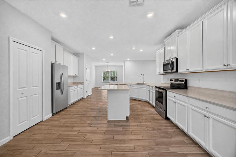 Kitchen hallway with pantry door at 9905 Ansley Lake Dr, Jacksonville, FL