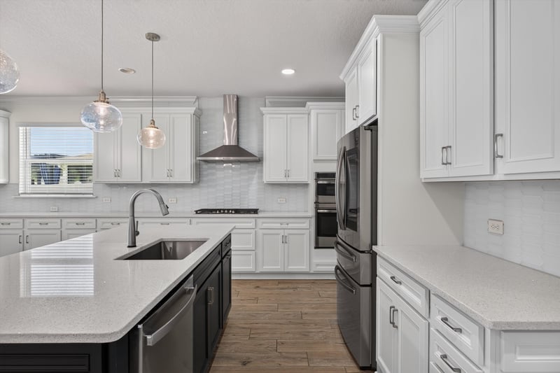 Kitchen island with stainless refrigerator at 855 Flach Dr, St. Johns, FL