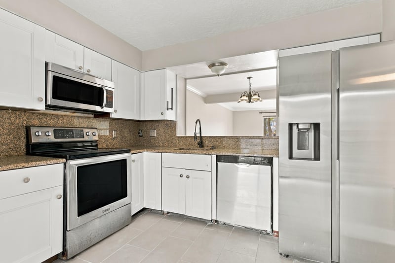 Kitchen wide view with pendant light at 7703 Las Palmas Way