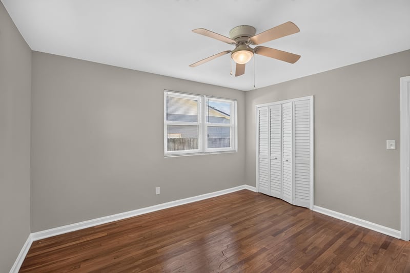 Bedroom with closet and hardwood floors at 6338 Mercer Cir W, Jacksonville, FL
