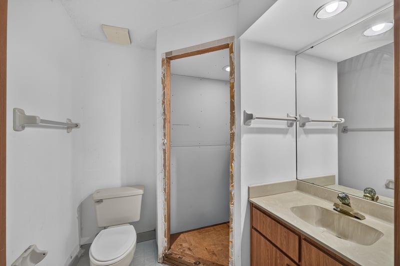 Bathroom with toilet and unfinished closet at 2910 Ravines Rd, Middleburg, FL 32068