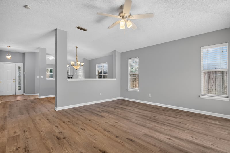 Open living area with vaulted ceiling and chandelier at 1108 Hidden Cove Cir S, Atlantic Beach, FL 32233