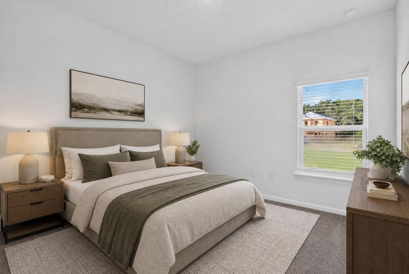 Virtually staged primary bedroom with window at 269 Bluegrass Wy, St. Augustine, FL 32092