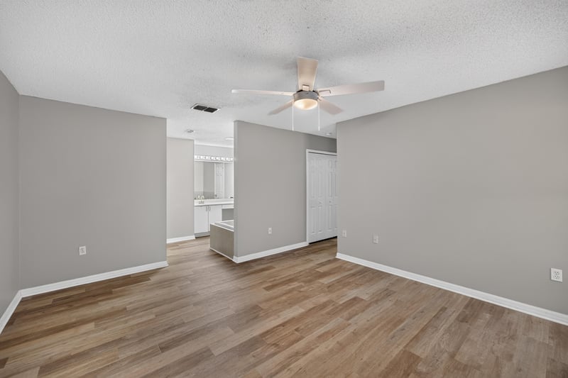 Bedroom with ceiling fan and wood-look floor at 1845 Saga Ct, Middleburg, FL