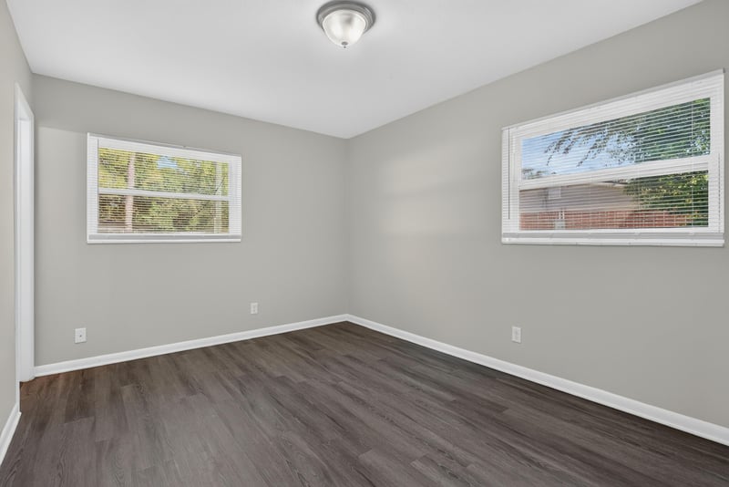 Room with two windows and wood-look floor at 5503 Boeing Dr, Jacksonville, FL 32207