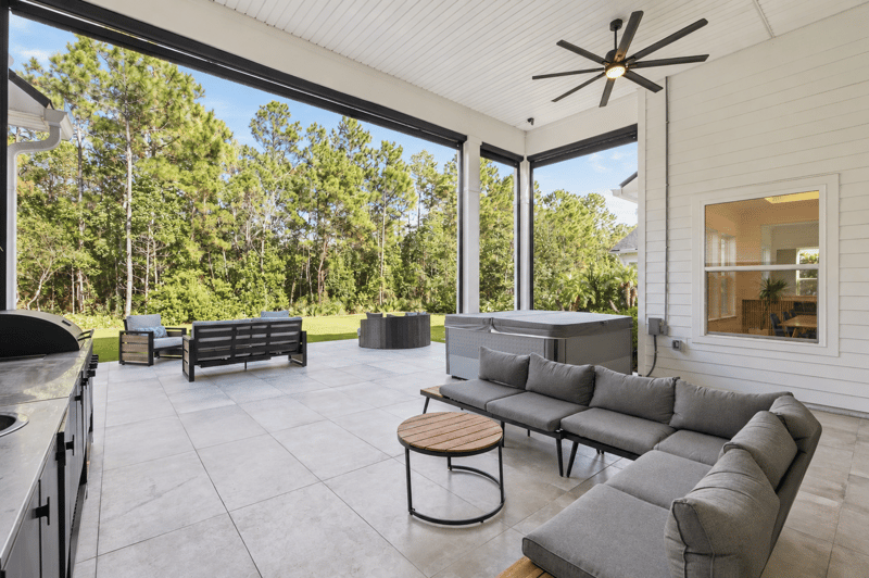 Covered patio with sofa seating and ceiling fan at 907 Seagrove Dr, Ponte Vedra Beach, FL 32081