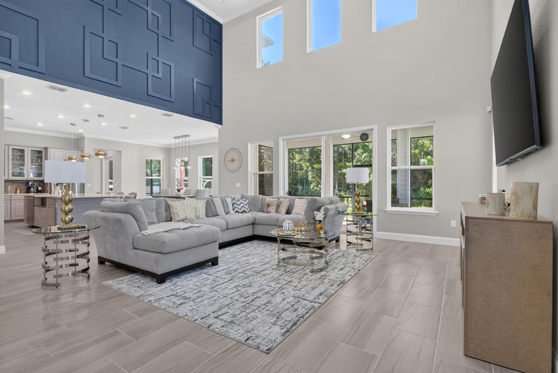 Two-story great room with sectional sofa at 22 Azura Point