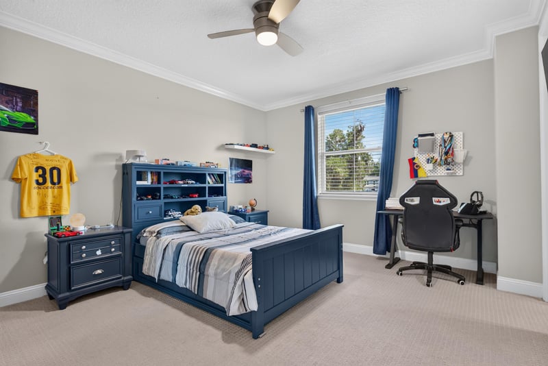 Bedroom with blue dresser at 22 Azura Point