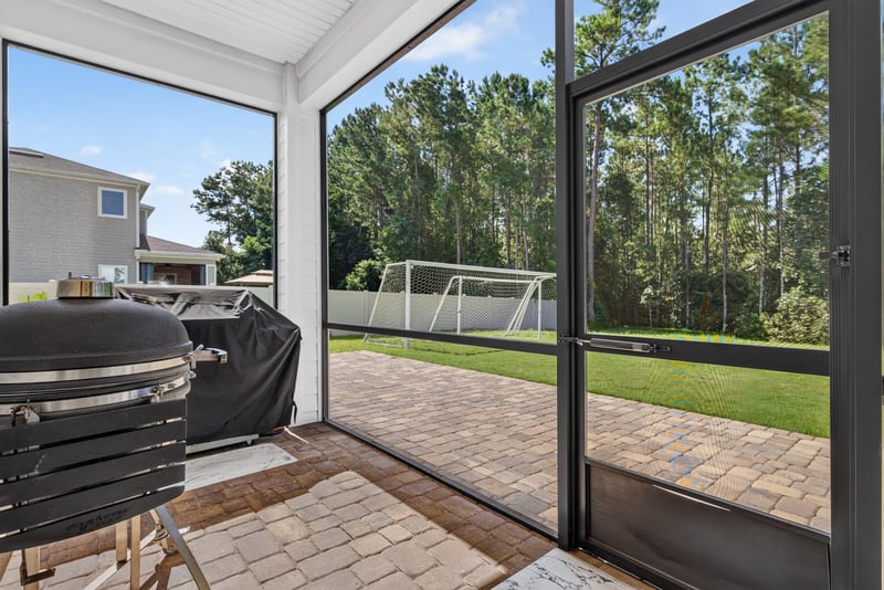 Screened porch view toward backyard at 22 Azura Point
