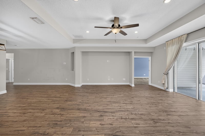 Living room with ceiling fan and wood flooring at 53 Lumen Ct, St. Augustine, FL 32095
