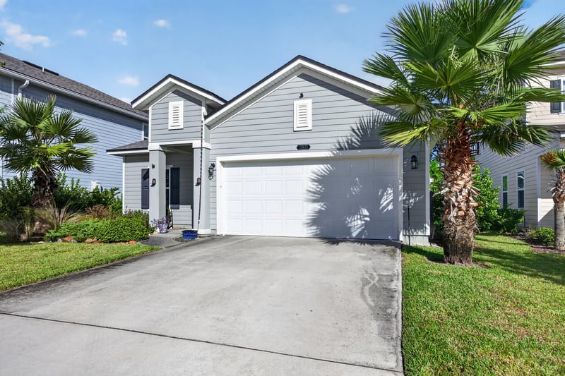 Front exterior close on garage and driveway at 75875 Saffron Ln, Yulee, FL 32097